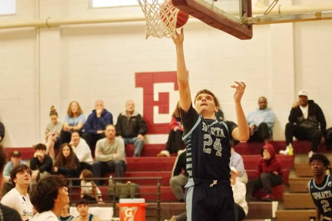 SB4 Sparta's Chrystian Grubbs shoots during the second half. He scored 14 points.