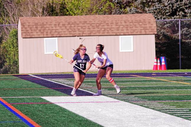 Sports roundup: Pope John wins H/W/S title Pope John's Olivia Zywicki carries the ball while covered by Lenape Valley's Addison Coles. Zywicki scored one goal.