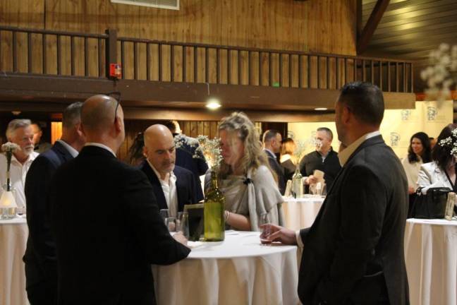 Guests sample the wine at the ninth annual Wine &amp; Food Pairing, which raised funds for the Sparta Education Foundation on March 4. (Photos by Carlos Davidson)