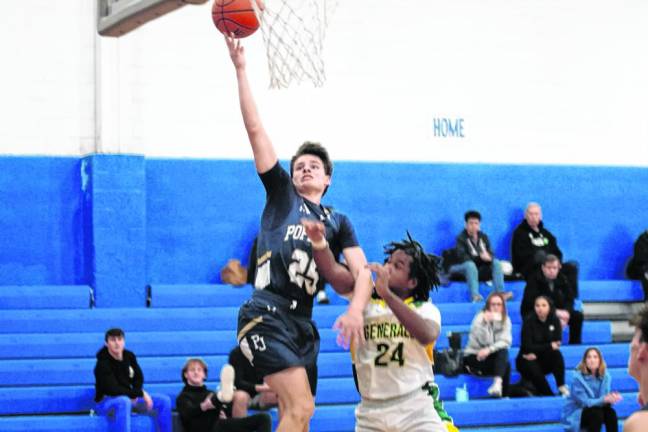 Pope John's Anthony Schnabel takes the ball toward the hoop. He scored 11 points.