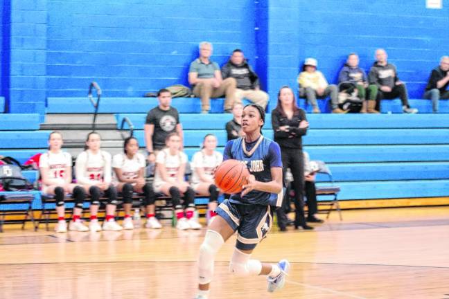 Pope John's Mia Washington scored 17 points. (Photo by George Leroy Hunter)