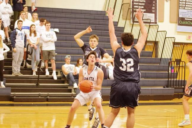 Sparta's Aidan Mastandrea maneuvers the ball between a pair of Chatham defenders in the second quarter. Mastandrea scored 25 points.