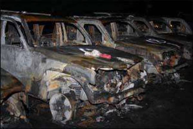 Dozens of vehicles lost in early morning fire Dozens of vehicles lost in early morning fire