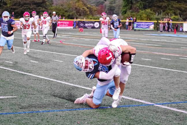 Vernon shuts out Dover <b>FB5 A Lakeland ball carrier is tackled by a Sparta defender.</b>