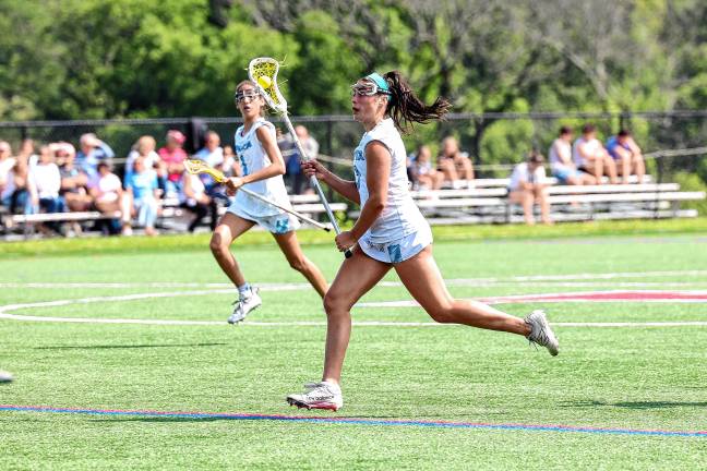 Photos: Spartans in Group 2 final Uma Kowalski of Sparta takes the ball downfield in the sectional final against Mendham.