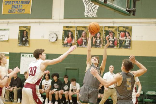 Sussex Tech defeats Newton ST2 Sussex Tech’s Eliot Griner lifts the ball toward the hoop. He scored 16 points.
