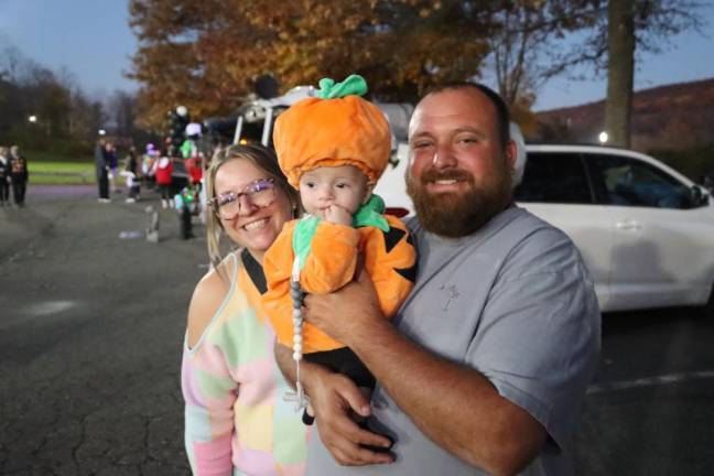 Elizabeth and James Mullen pose with their little pumpkin, Thomas, 4 months.