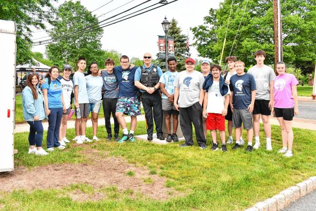 Photos: Law Enforcement Torch Run Officer Chris Favaro poses with special-needs children before he gave them a tour of the Sparta Police Department.