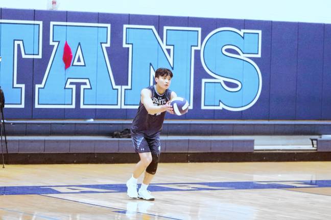 Sports roundup: Pope John wins H/W/S title Sparta's Joshua Tolentino (27) in the midst of a serve.