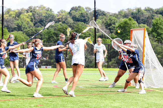 Photos: Spartans in Group 2 final Sparta’s Uma Kowalski fires a shot on Mendham’s Sabrina Saunders in the first half of the game.