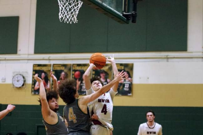 Sussex Tech defeats Newton Newton’s Ayden Babakissina (4) takes the ball toward the hoop.