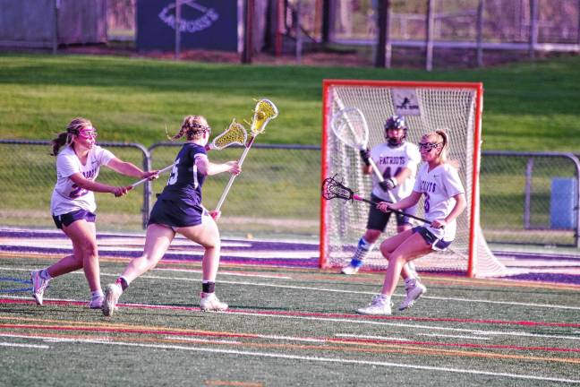 Sports roundup: Pope John wins H/W/S title Lenape Valley players defend their goal from an incoming Pope John player.