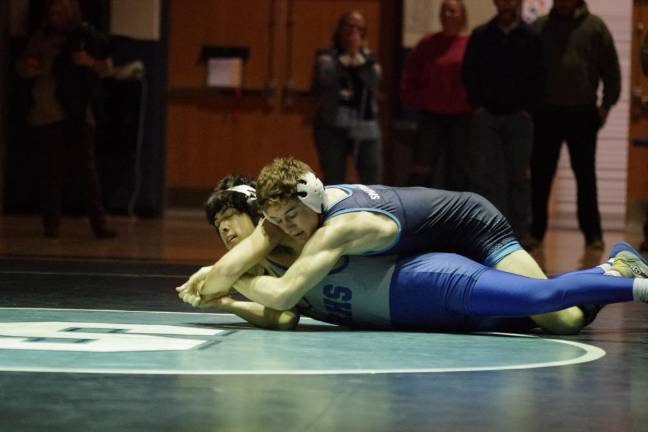 Sparta’s Ryan Hrenenko, top, grapples with Kittatinny’s Dylan Zupkay in the 126-pound weight class. Hrenenko pinned Zupkay in 2:40.