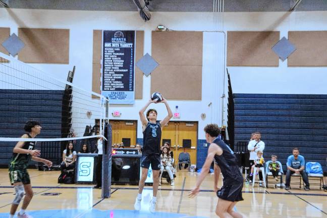 Sports roundup: Pope John wins H/W/S title Sparta's George Tsamadias (5) performs a ‘set’ maneuver.