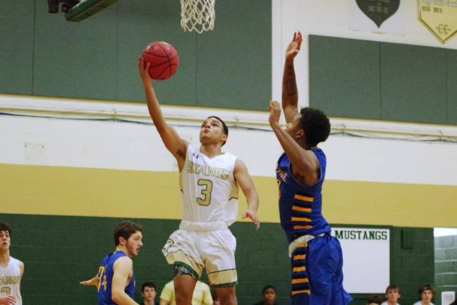 Sussex Tech's Isaiah Sanchez raises the ball towards the hoop in the third quarter. Sanchez scored 6 points, grabbed 5 rebounds, made 7 assists and is credited with 4 steals.