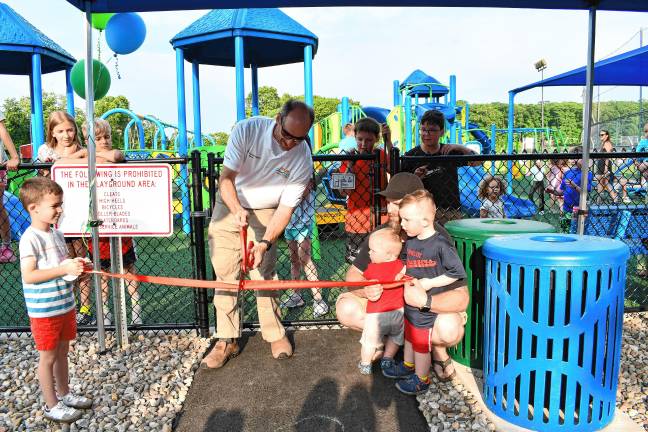 Inclusive playground opens CIP3 Byram Mayor Alex Rubenstein cuts a ribbon to formally open the township’s completely inclusive playground Friday evening, June 6 at C.O. Johnson Park. (Photo by Maria Kovic)