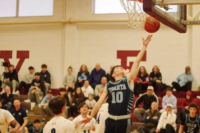 Sparta's Patrick Connors releases the ball during a shot in the second half. He scored five points in the tournament finals Friday, Dec. 29.