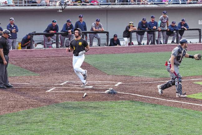 Miners lead division <b>MN2 The Miners’ Alec Sayre crosses home plate to score in the first inning, moving the team ahead of the Rox, 3-1.</b>