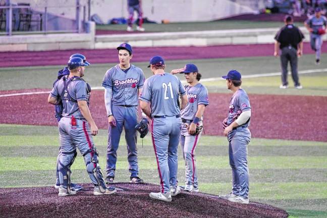 Miners lead division <b>The Brockton Rox meet on the pitchers mound.</b>