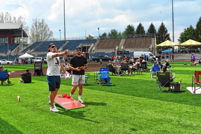 Miners open 10th season Thursday <b>Corn hole is one of the activities.</b>