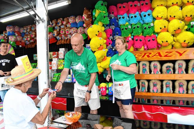 Photos: Our Lady of the Lake carnival in Sparta Steve and Amy Marshall of Sparta operate a game at the annual Our Lady of the Lake carnival in Sparta. (Photos by Maria Kovic)