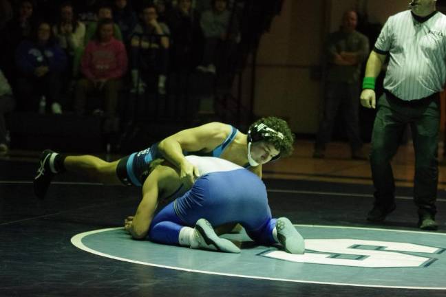 Sparta's Lucas Brown is on top of Kittatinny's Alex Laoudis in the 215 pound weight class. Brown won by ultimate tie breaker 3-2.