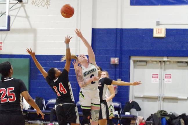 Sussex County's Phoebe H. Livingston tosses the ball towards the hoop in the first quarter.