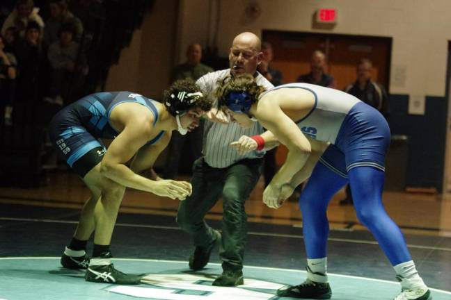 Sparta’s Lucas Brown, left, faces Kittatinny’s Alex Laoudis in the 215-pound weight class. Brown won by ultimate tie breaker, 3-2.
