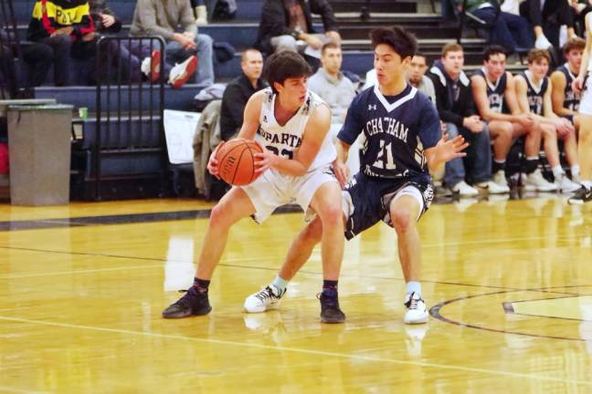 Sparta's Aidan Mastandrea maneuvers the ball while covered by Chatham's Jameson Shi in the first half. Mastandrea scored 25 points.