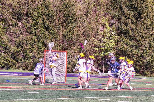 Sports roundup: Lions advance to H/W/S quarterfinal Jefferson goalkeeper Jamison Reid (13) intercepts the ball with his crosse, preventing a Pope John goal. He made 12 saves.