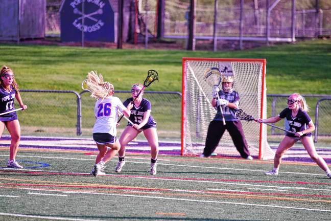 Sports roundup: Pope John wins H/W/S title Pope John players defend their goal post from an incoming Lenape Valley player.