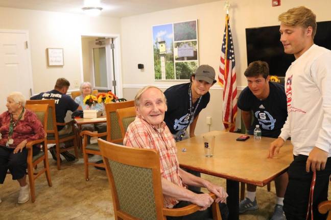 Residents an Sparta football players couldn't help but smile as they got to know one another at Knowl View.