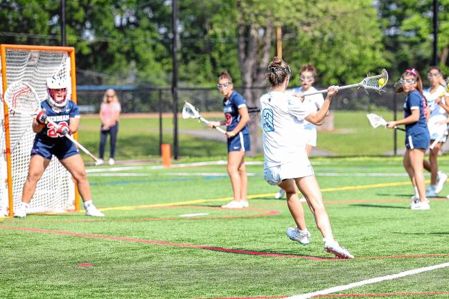 Photos: Spartans in Group 2 final Ava Capeci of Sparta winds up for a shot against Mendham’s Sabrina Saunders.