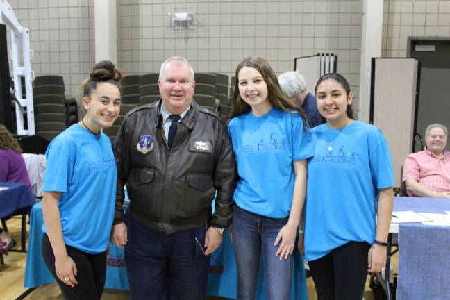 Volunteers step up for homeless vets at Stand Down From left, Riley Cavanaugh, Canavan Storms, Raina Dhand, all of Sparta with Brigadier General Michael L. Cunniff of The National Guard.