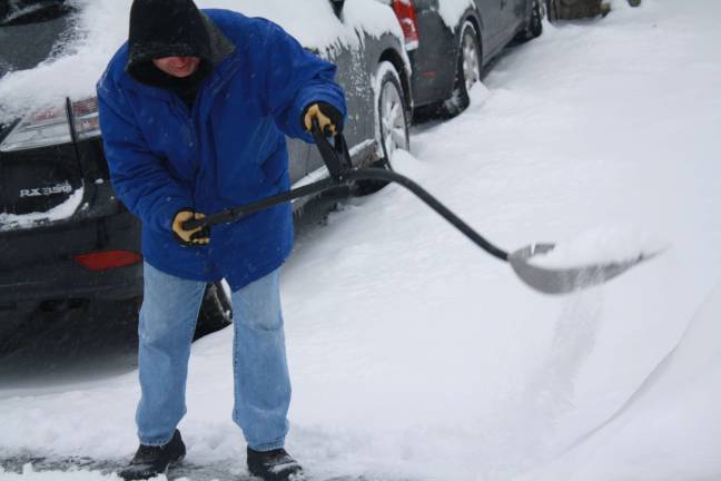 'Historic' storm never comes, but Sparta still digs out Bob Kay shoveling after the storm on Tuesday morning. photos by rose sgarlato