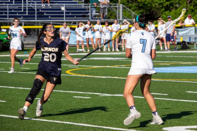 Vernon attacker Makenna Thomas (20), tries to check the ball from Spartan midfielder Uma Kowalski (7). Spartan midfielder Aine Byrne (14) communicates that she is open to her teammate.