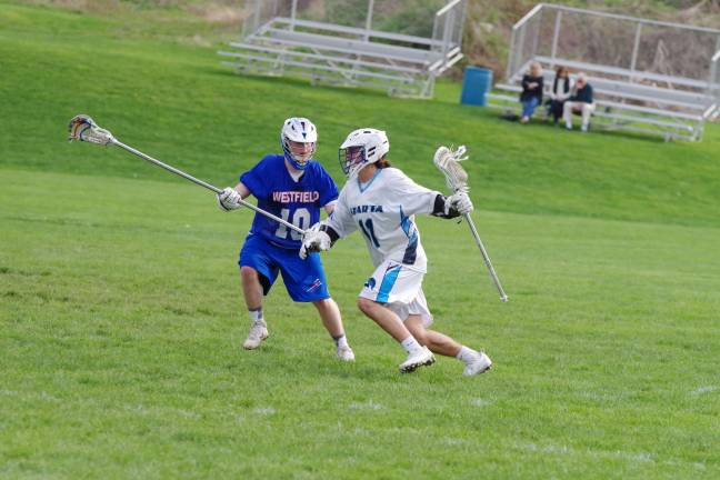 Spartans top Blue devils in boys lacrosse Sparta's Jesse West advances the ball as Westfield's Pat McIlroy keeps pace. West scored three goals.