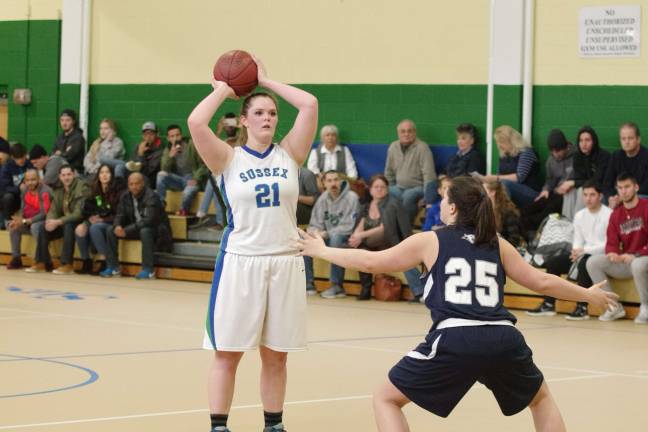 Camden beats Sussex in girls hoops Sussex County's Hannah Delbury scans the court for an open teammate to pass the ball to. Delbury scored four points, blocked three shots and is credited with one steal.
