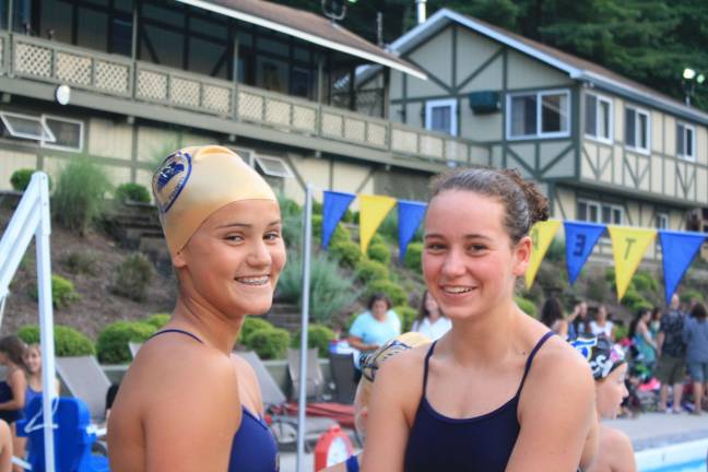 Swim team falls in home meet Bridget Hilgendorf and Lizzie Wolfe take a break in between races.