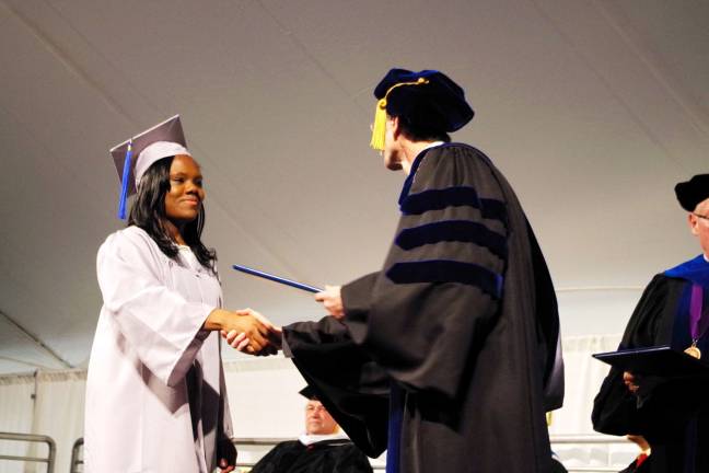 Graduate Faith Scott (Medical Assisting) of Newton is congratulated.