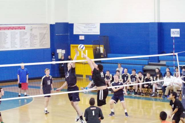 Pope John's strikes down Dover in volleyball Pope John's Andrew Ward and Dover's Ronald Mendez battle for control