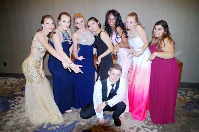 Prom night for Sparta High School James Pillion (18) poses with from left Genesis Sanchez (15), Jaime Golden (17), Hannah Newbold (18), Daniela Hernandez (16), Lexi Reeder (16), Haley Singer (16) and Victoria Montesano (16).