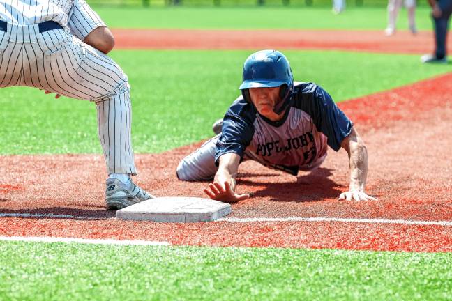 Photos: Pope John in baseball finals Andrew Pami gets back to first base safely on a pick-off attempt by Morristown-Beard in the top of the fourth inning.