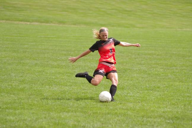 SCCC drubs Northampton in women's soccer Northampton's Megan McCarty in the midst of kicking the ball in the first half. McCarty is from Pen Argyl, Pennsylvania.