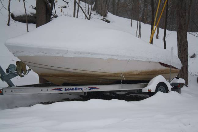 A boat is covered from the storm.