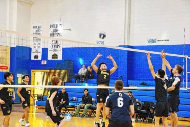 Bergen Charter's Andrew Wu (2) leaps toward the ball.