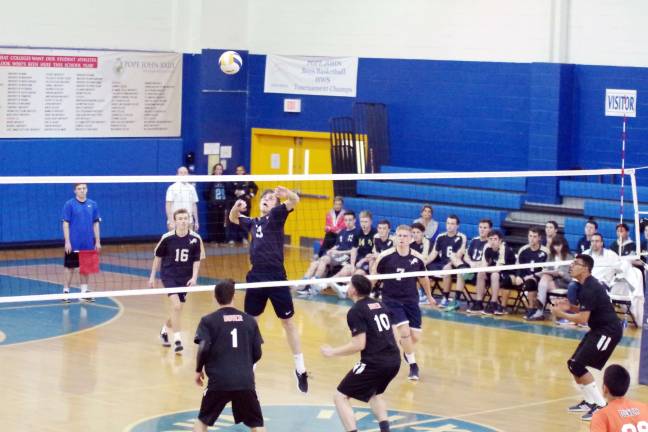 Pope John's strikes down Dover in volleyball Pope John's John Geba leaps towards the falling ball.