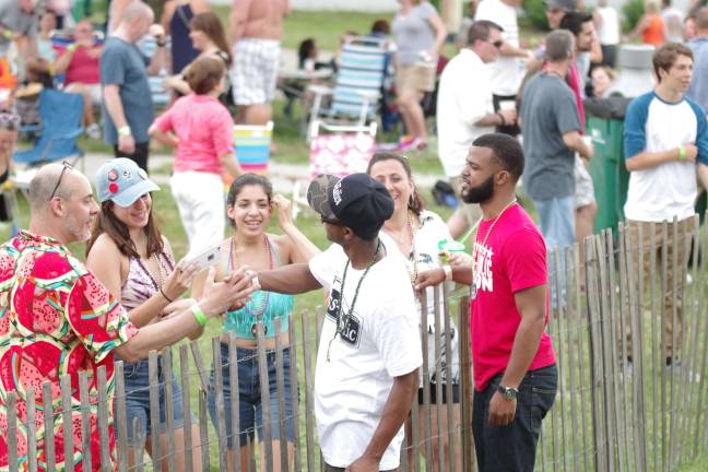 Crawfish fest goes 'down home' A couple Brass-A-Holics band members greet thieir fans.