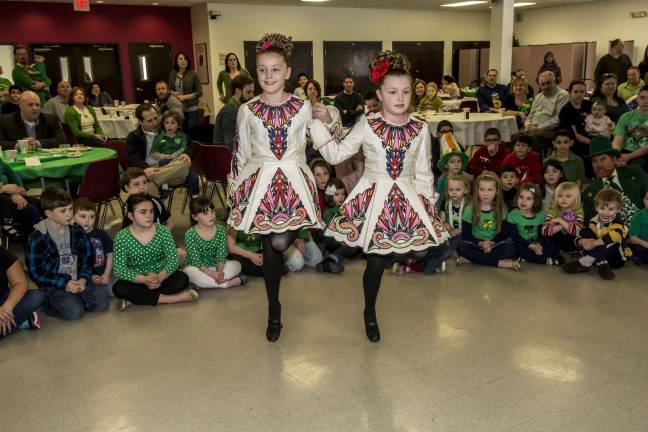From left: Irish dancers Bailey Chapman, 8, of Sparta and sister Molly, 7, dance for the crowd.