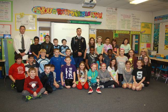 Local soldier visits pen pals Helen Morgan fifth grade pen pals with Logan Lynch and teachers Matt Martinka and Susan LaBell. photos by rose sgarlato